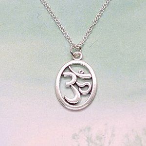 Buddhist OM in Oval Silver Necklace